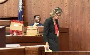 Deputy Solicitor Mary Jones, foreground, evokes an angry reaction from murder defendant Nayquan Gadson.
