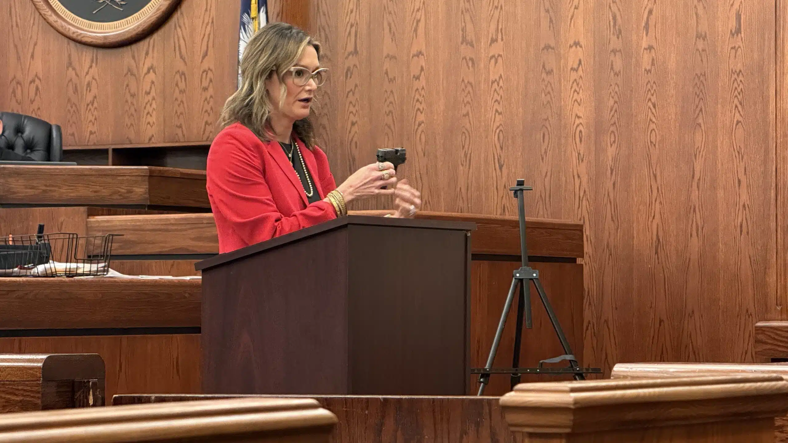 Deputy Solicitor Mary Jones shows jurors the gun Jeremiah McGee-Ashton used to kill Tony Haynes during her closing argument Thursday, March 26, 2026. McGee-Ashton was convicted of voluntary manslaughter.