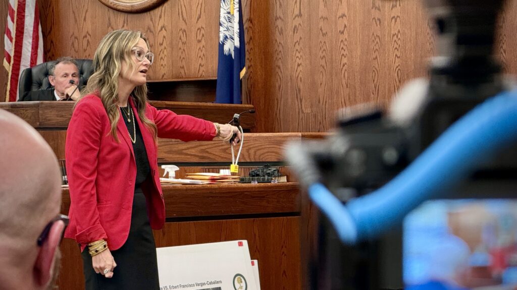 Mary Jones holds the murder weapon as she delivers her closing argument in the trial of Erbert Francisco Vargas-Caballero. The defendant was convicted in the 2024 killing of his roommate Jarin Josiel Avila-Chirinos during a trial in May 2026 at the Beaufort County Courthouse.